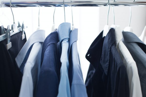 Male shirts hanging on a rack